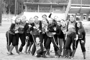 The Lady Falcon fastpitch team celebrates teammate Melanie Murphy's birthday in the outfield Wednesday. From left: Natalie Martinovic