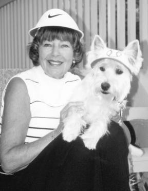 Anita Johnson and Yogi are among the 21 seniors and their pets pictured in the “Darling Doggies” calendar that benefits South Whidbey Senior Center.