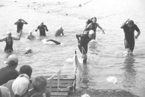 Swimmers emerge from Lone Lake following the first leg of the Whidbey Triathlon