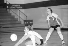 Senior Nici Eaton digs the ball out as junior Amy Brown watches during South Whidbey’s 3-0 win Tuesday over Lakewood.