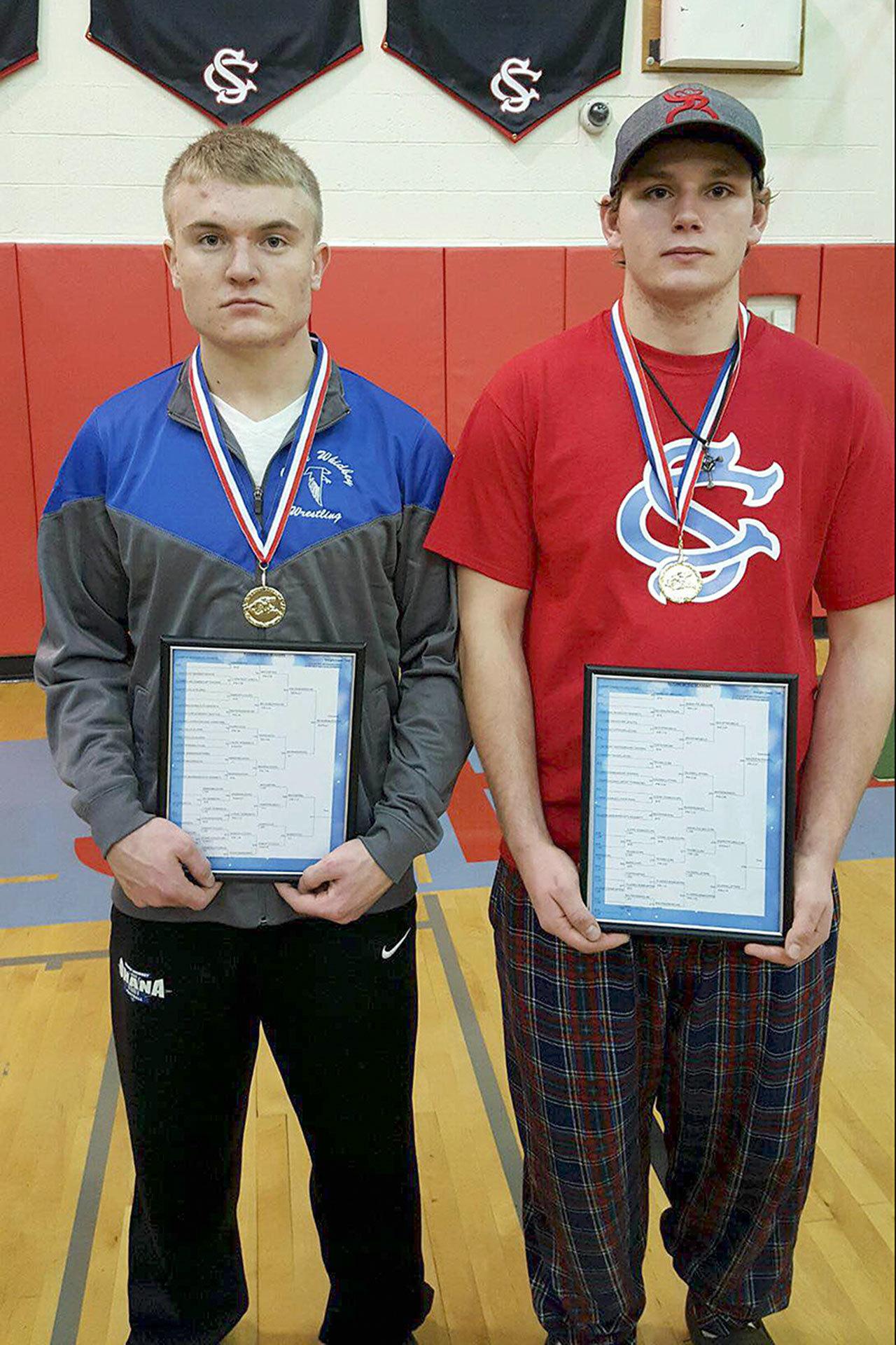 Jim Thompson photo                                South Whidbey wrestlers Hunter Newman (left) and Logan Madsen (right) won the 145 and 195-pound brackets at the Return of the Seahawk tournament on Dec. 3.