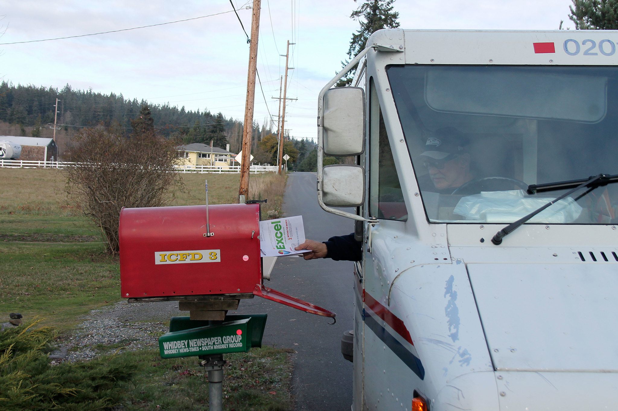 Kyle Jensen / The Record                                Postal carrier Sam Wolfe drops off mail at the South Whidbey Fire/EMS Station 31 in Freeland. South Whidbey has seen a string of attempted mail thefts in the past few weeks.
