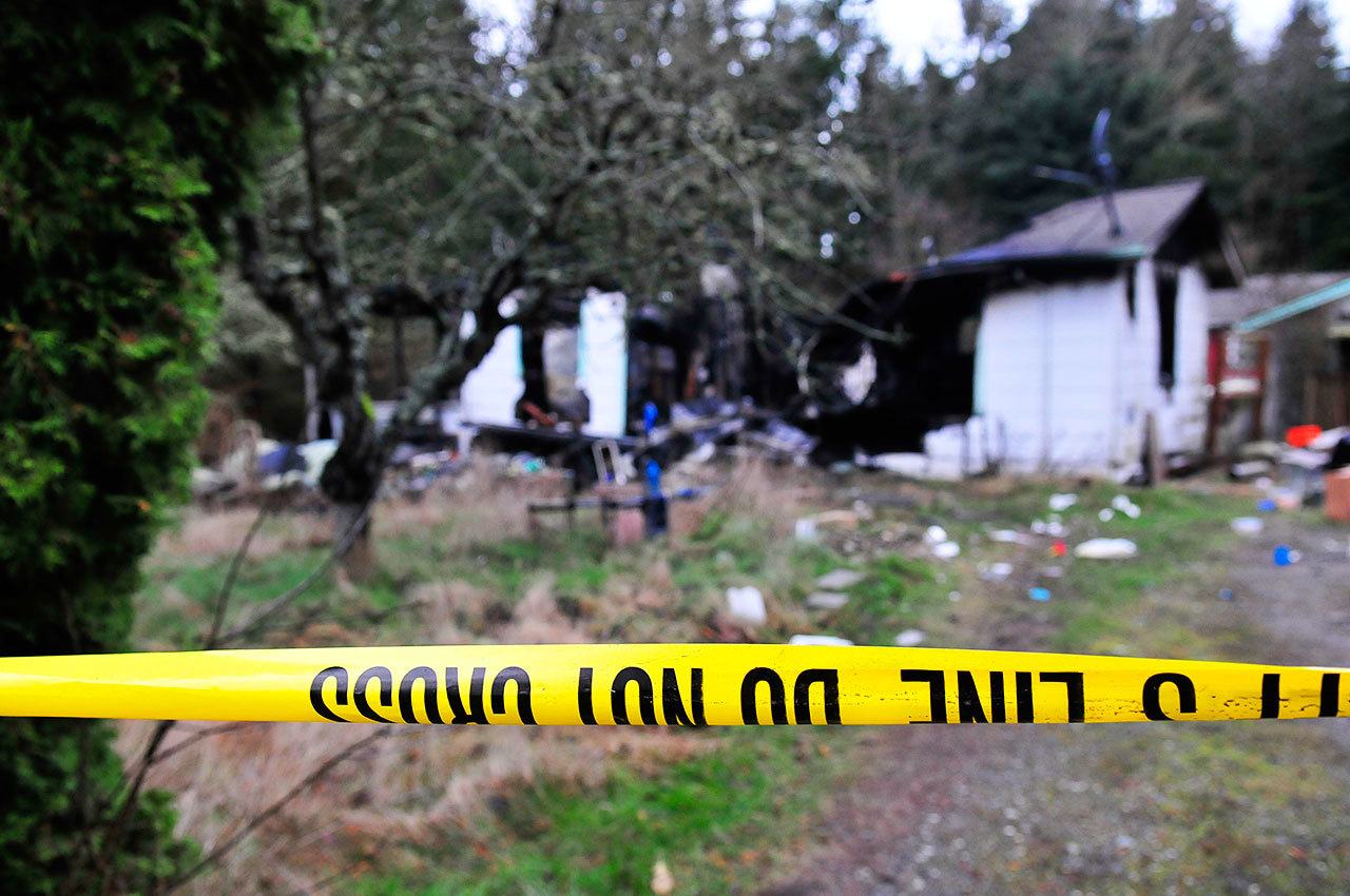 Michael Watkins / Whidbey News Group                                Authorities are still investigating the cause of a residential fire in the 4000 block of DeGraff Road that claimed the lives of a mother and her two young children Sunday in Oak Harbor.