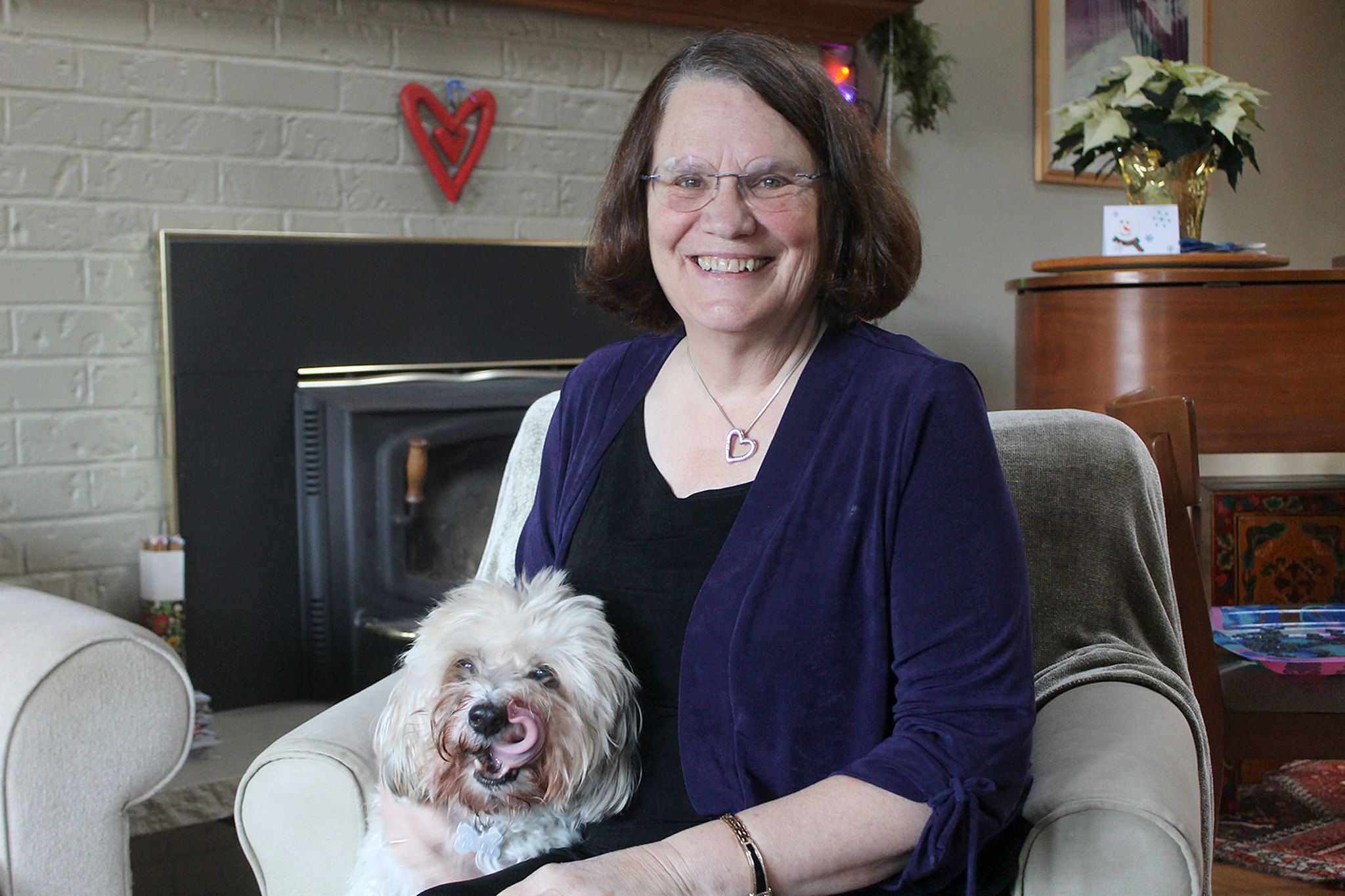 Evan Thompson / The Record                                Peggy Taylor sits with her dog Chico at her home in Langley.