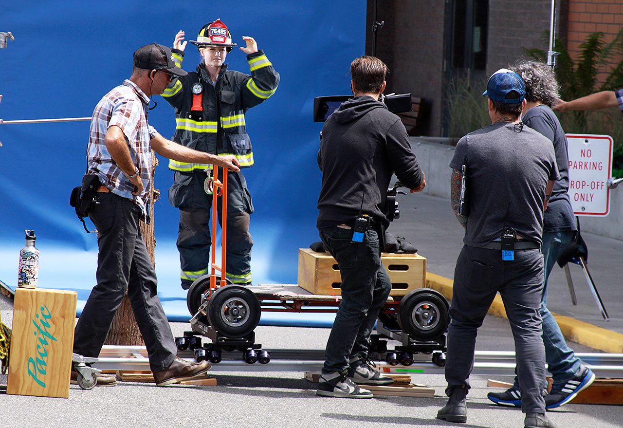 An Alaska Airlines commercial was shot on three Whidbey Island locations, including next to the Coupeville High School gym in late June. The building’s brick wall was supposed to resemble a fire department. Photo by Ron Newberry/Whidbey News-Times
