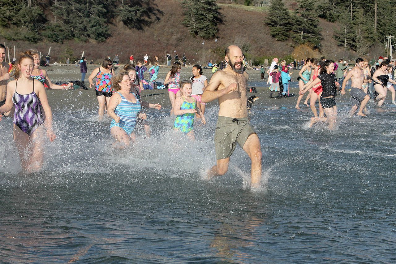 Polar bears dip into new year at Double Bluff Beach Park South
