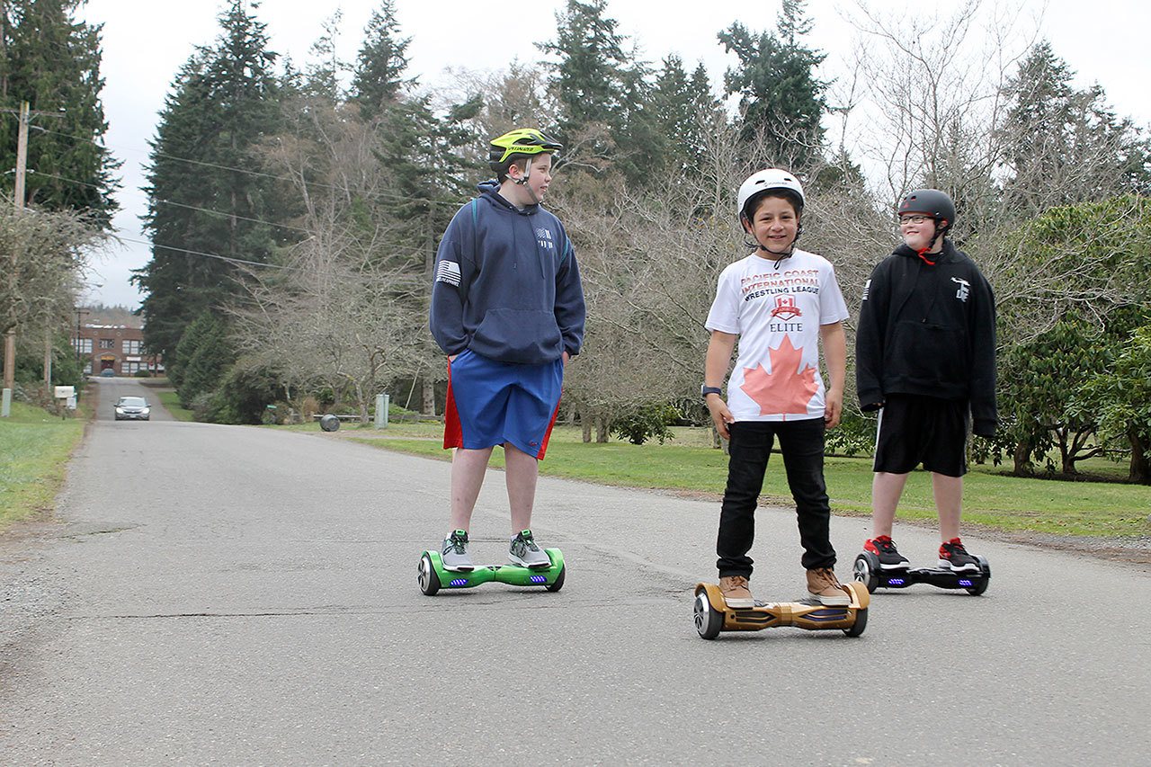 Evan Thompson / The Record                                Joshua Marks, 13, Isaiah McClure, 11, and Jacob Marks, 11 ride hoverboards down Edgecliff Drive. The area, including Decker and Furman Avenues, could see improvement in its infrastructure in the next half-decade.