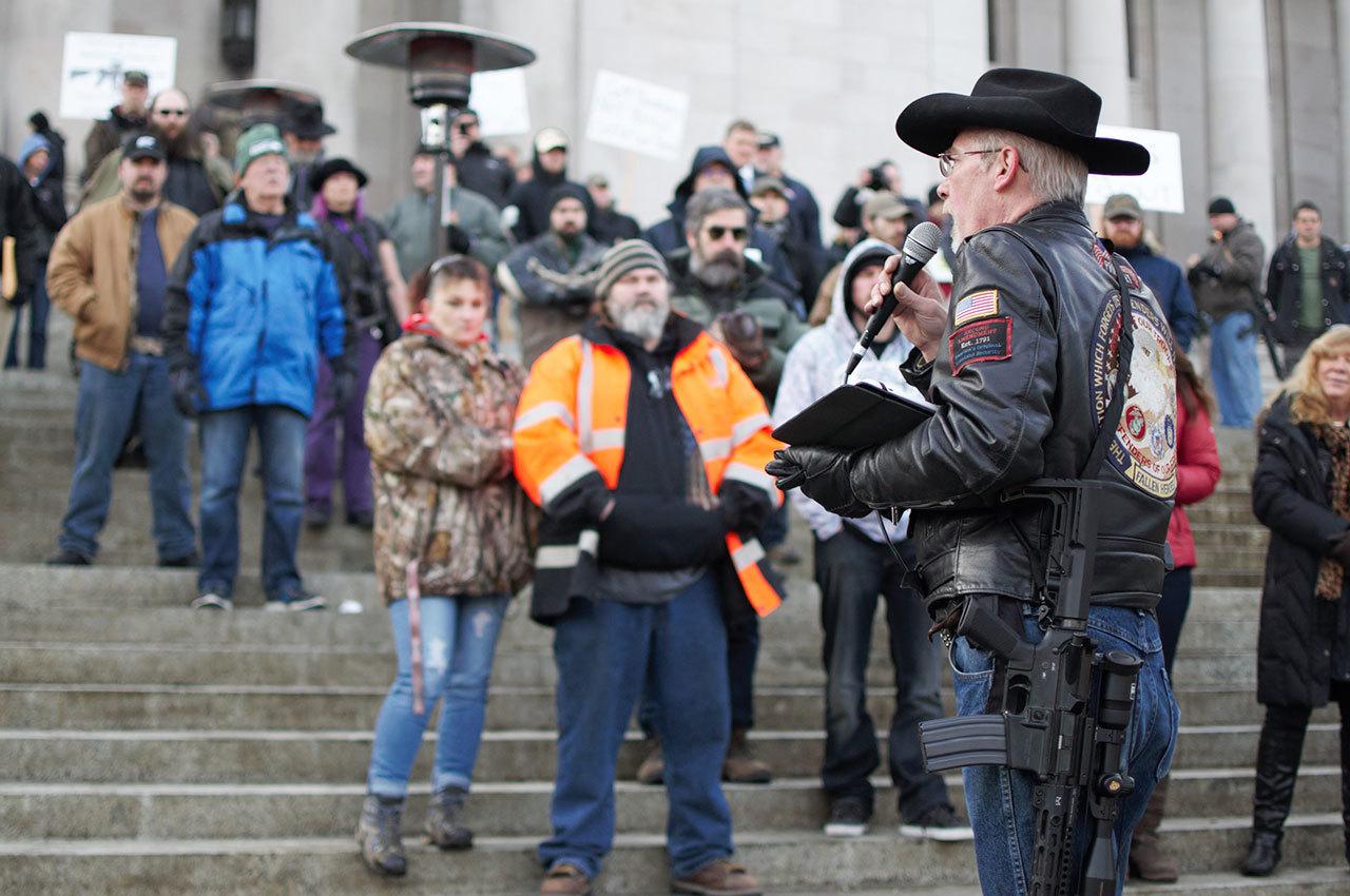 Enrique Pérez de la Rosa / WNPA                                Rick Halle, national coordinator of the Gun Rights Coalition, addresses attendees to the Rally 4 UR Rights rally at the Washington State Capitol Jan. 13. “Gun rights is a non-partisan issue,” Halle said, urging supporters to remember the second amendment is an American right, not just a conservative or republican right. Various bills have been introduced to the legislature regarding gun rights and control, including a bill that would require gun dealers to offer to sell or give a lock or lock box with every gun sale.
