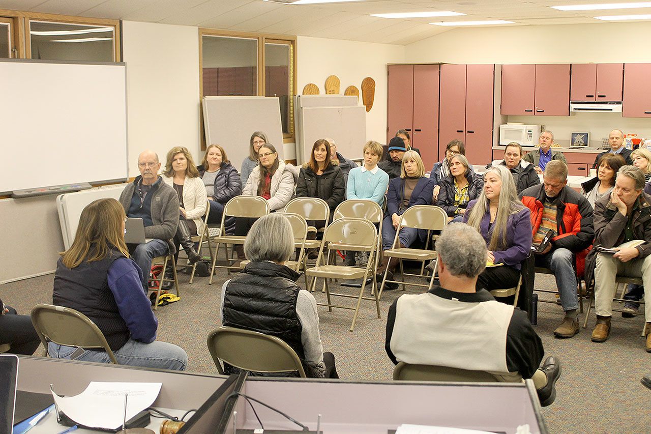 Evan Thompson / The Record — Parents, teachers and community members listen to the South Whidbey School Board as they discuss the closure of Langley Middle School at a workshop on Jan. 11. The board will vote whether or not to the close the historic school at 6:30 p.m. on Jan. 25 at South Whidbey Elementary School.