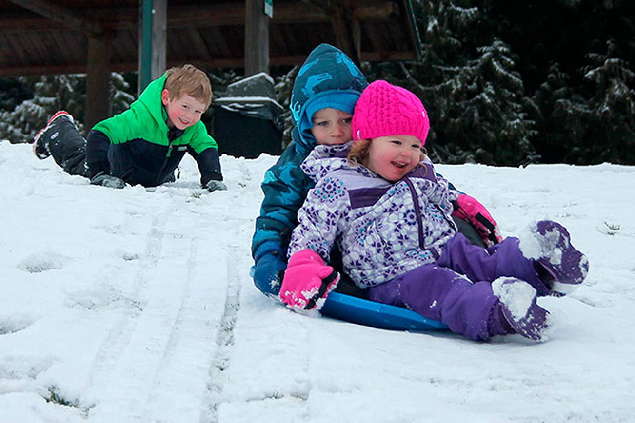 Kids swap books for boards, sleds and skis after Monday snowfall