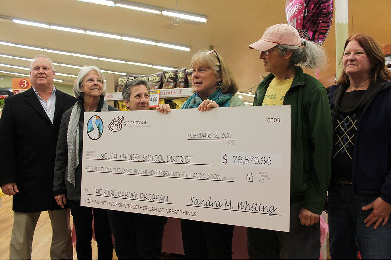 Kyle Jensen / The Record — Goosefoot Community Fund Executive Director Sandy Whiting (third from right) presents South Whidbey School District officials with a check for $73.575.36. Left to right: (???), Linda Racicot, Joe Moccia, Sandy Whiting, Cary Peterson and Marian Myszkowski.