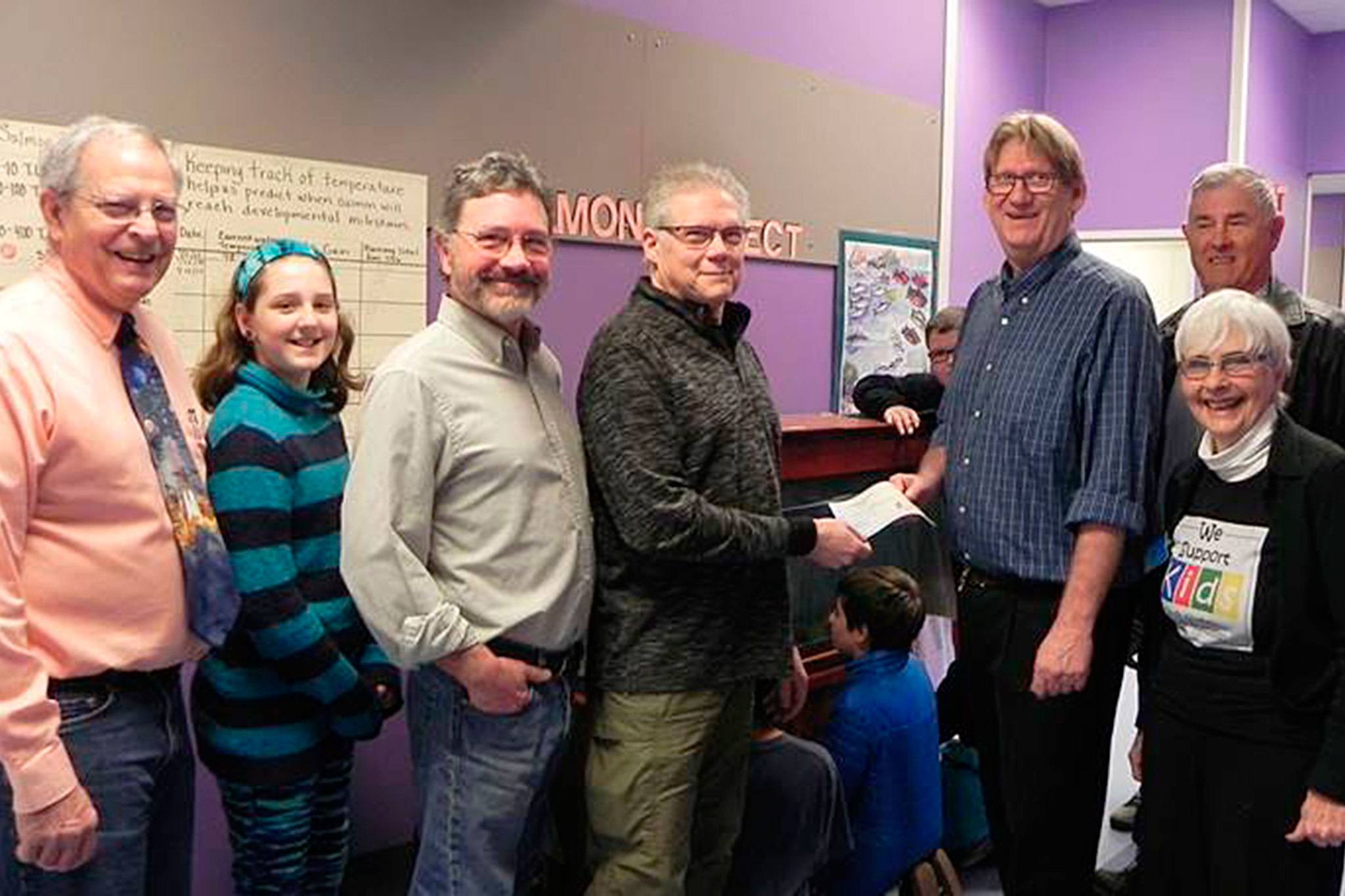 Contributed photo — Steve Mooney of Holmes Harbor Rod & Gun club presents fifth-grade teacher John LaVassar with a $1,200 check to fund the ‘Salmon in the Classroom” project. From left: fifth-grade teacher Bruce Callahan, student classroom salmon ambassador Macie Vandewerfhorst, and SWSF Board members Chris Gibson, Bob Wiley and Jean Shaw.