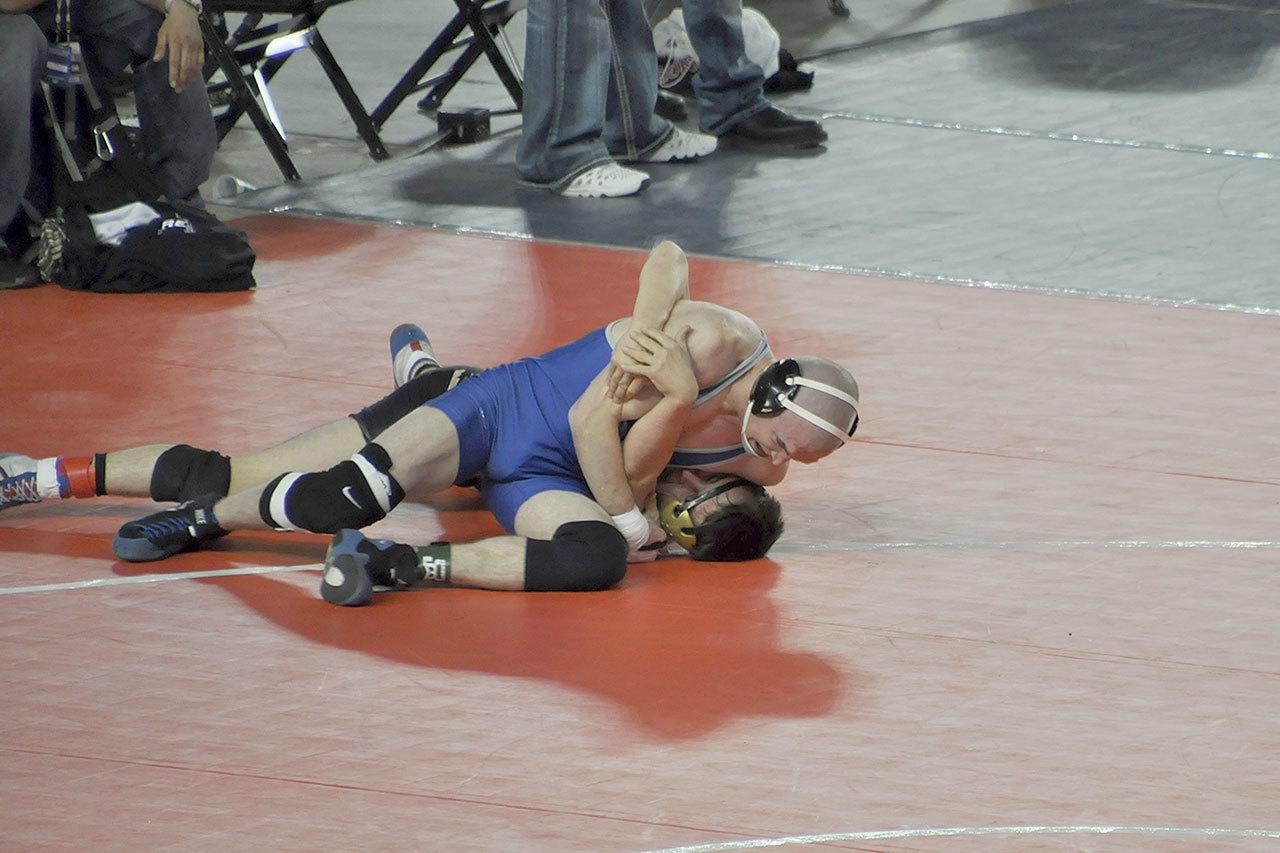 Meslissa Newman photo — South Whidbey senior wrestler Hunter Newman attempts to pin Royal’s Regan Callahan in the elimination round of the 138-pound bracket at the class 1A state championships on Feb. 17. Newman, however, was not awarded a takedown as he was deemed out of bounds by a referee.