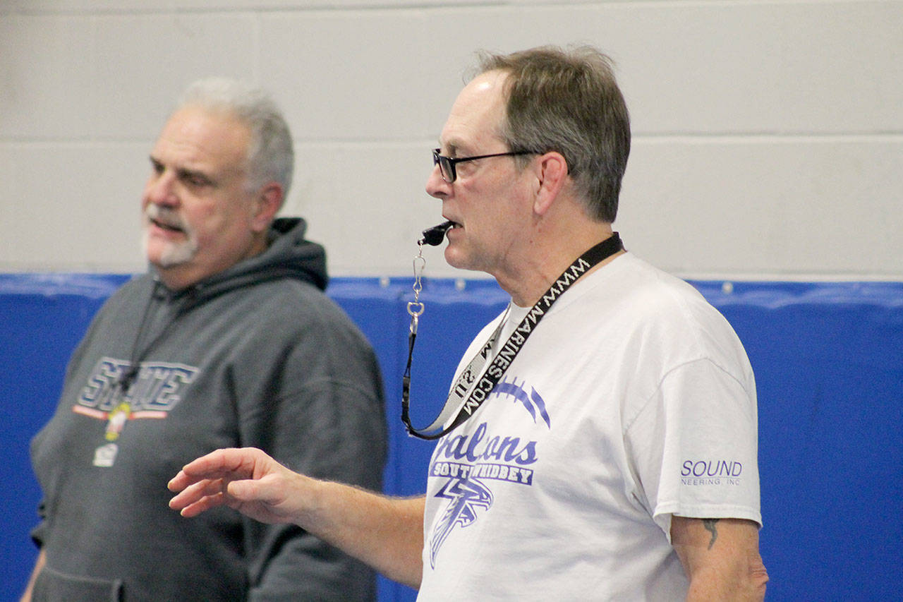 Evan Thompson / The Record — South Whidbey head wrestling coach Jim Thompson, right, has retired from the program. His assistant coach Paul Newman, left, is also contemplating retirement. The pair have spent the past 10 years molding teenagers into young men in the mat room and in competition.