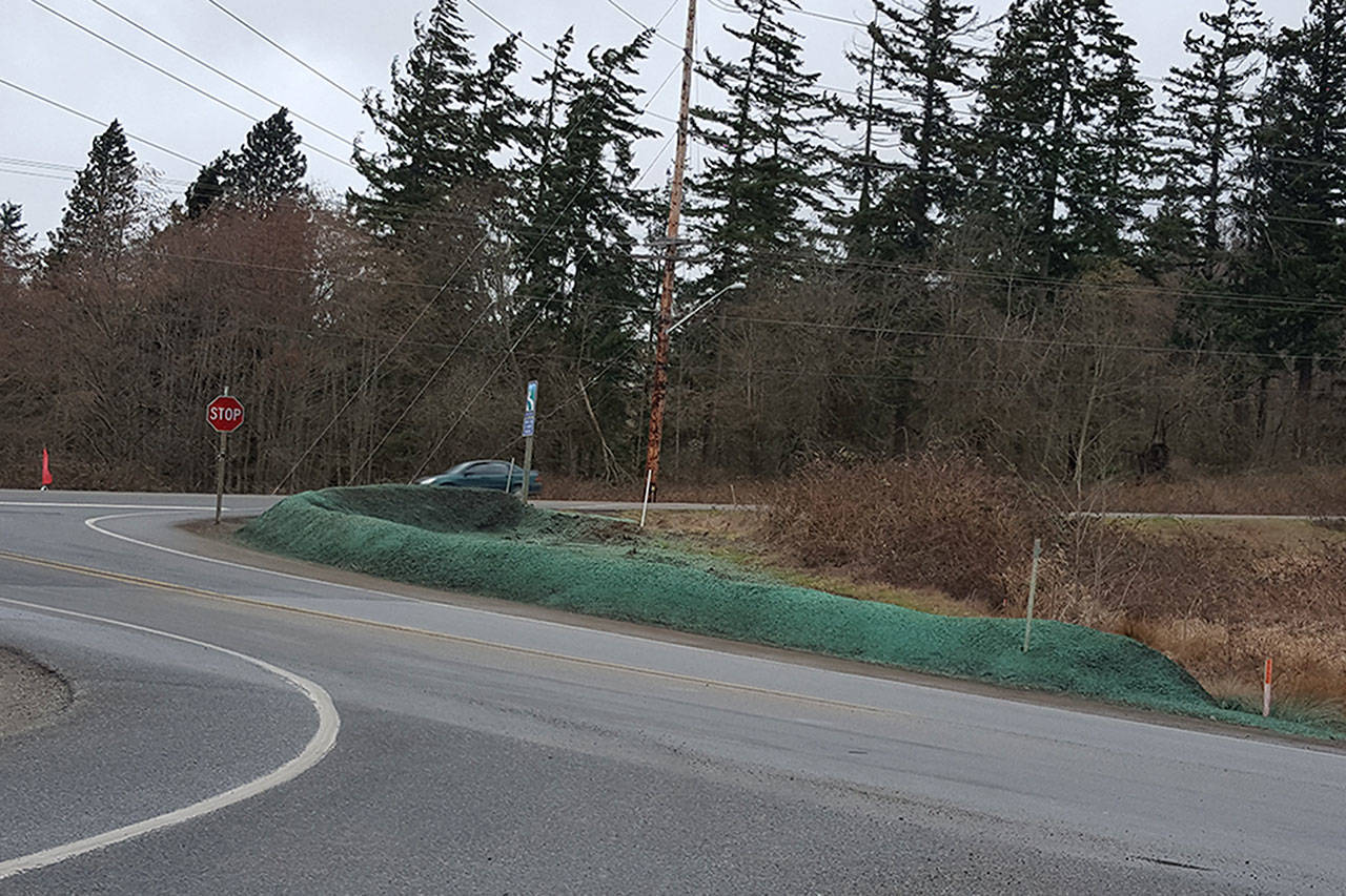 Pam Grant photo — A soil berm was recently constructed on the corner of Highway 525 and Honeymoon Bay Road in Freeland to restrict people from parking cars on the shoulder.