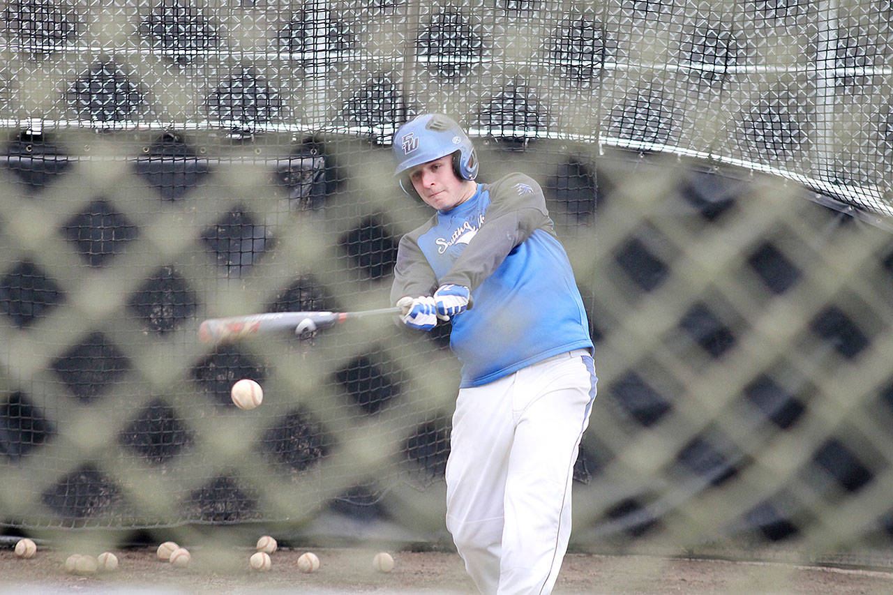 Evan Thompson / The Record &mdash; South Whidbey senior Will Simms swings at a ball during practice at South Whidbey High School&rsquo;s baseball field.