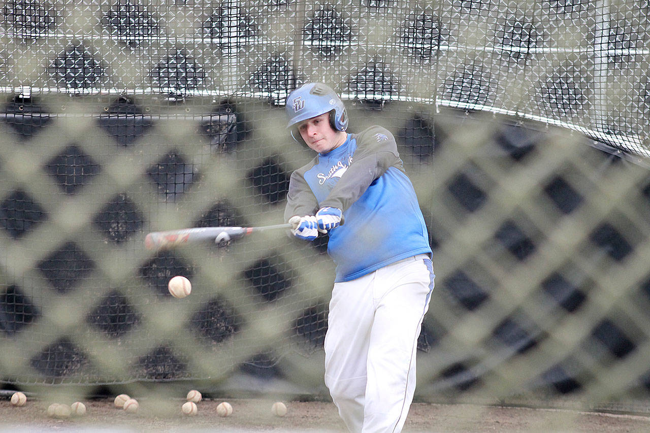 Evan Thompson / The Record — South Whidbey senior Will Simms swings at a ball during practice at South Whidbey High School’s baseball field.