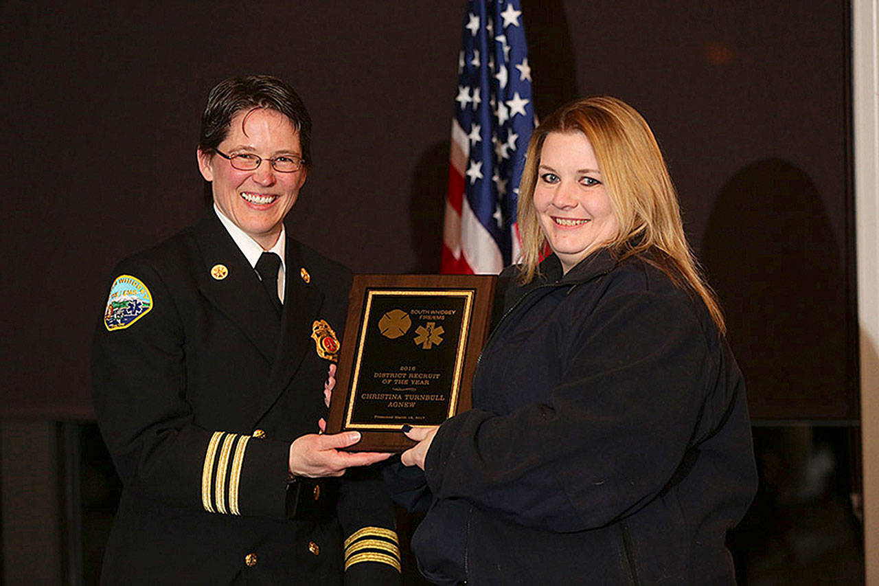 Photo courtesy of Stadler Studio — Christina Turnbull-Agnew receives the recruit of the year award from Deputy Chief Wendy Moffatt. She was also awarded the lifesaver medal, the highest award a volunteer can receive. She saved a family member’s life.