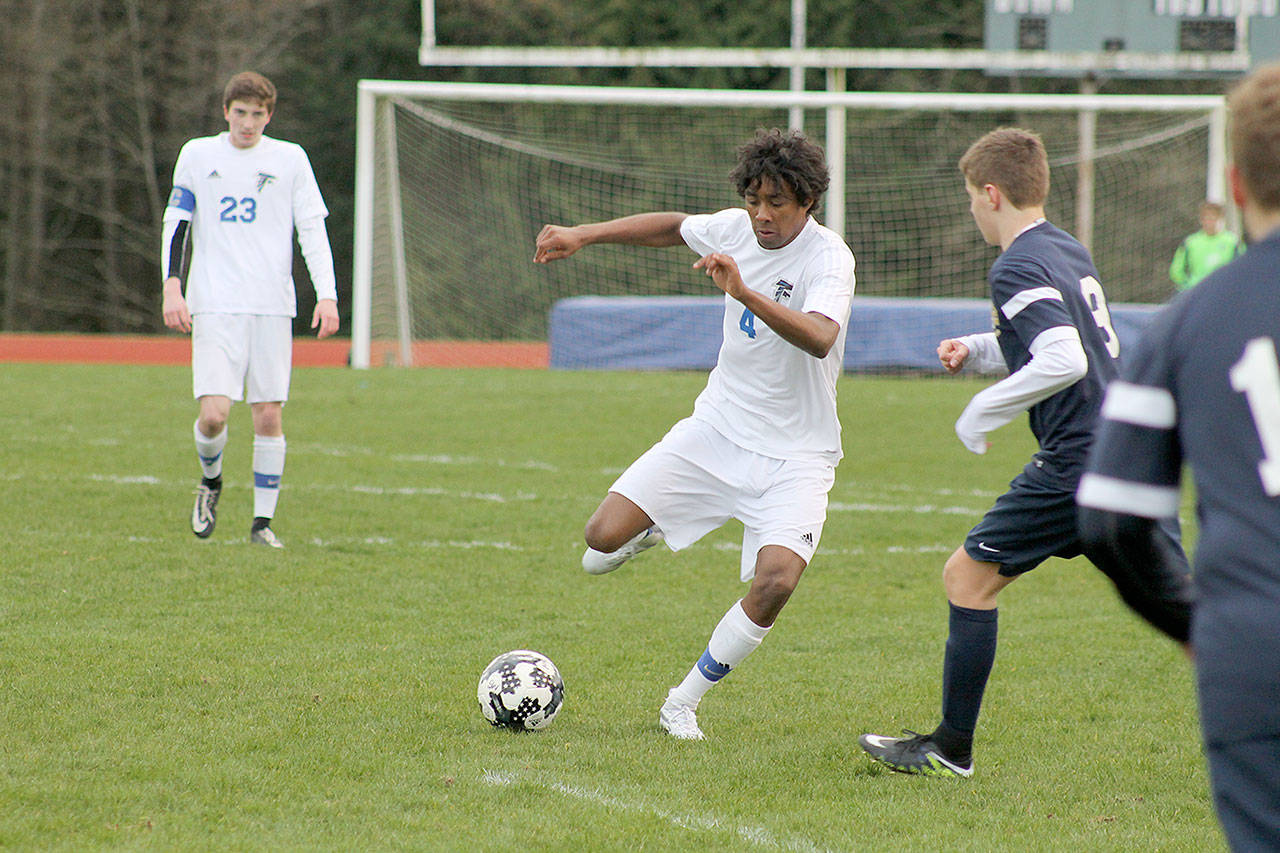 Evan Thompson / The Record &mdash; South Whidbey senior Justin Gonzales maneuvers around a Cedar Park Christian defender on Monday night at Waterman&rsquo;s Field. The Falcons won 10-0.