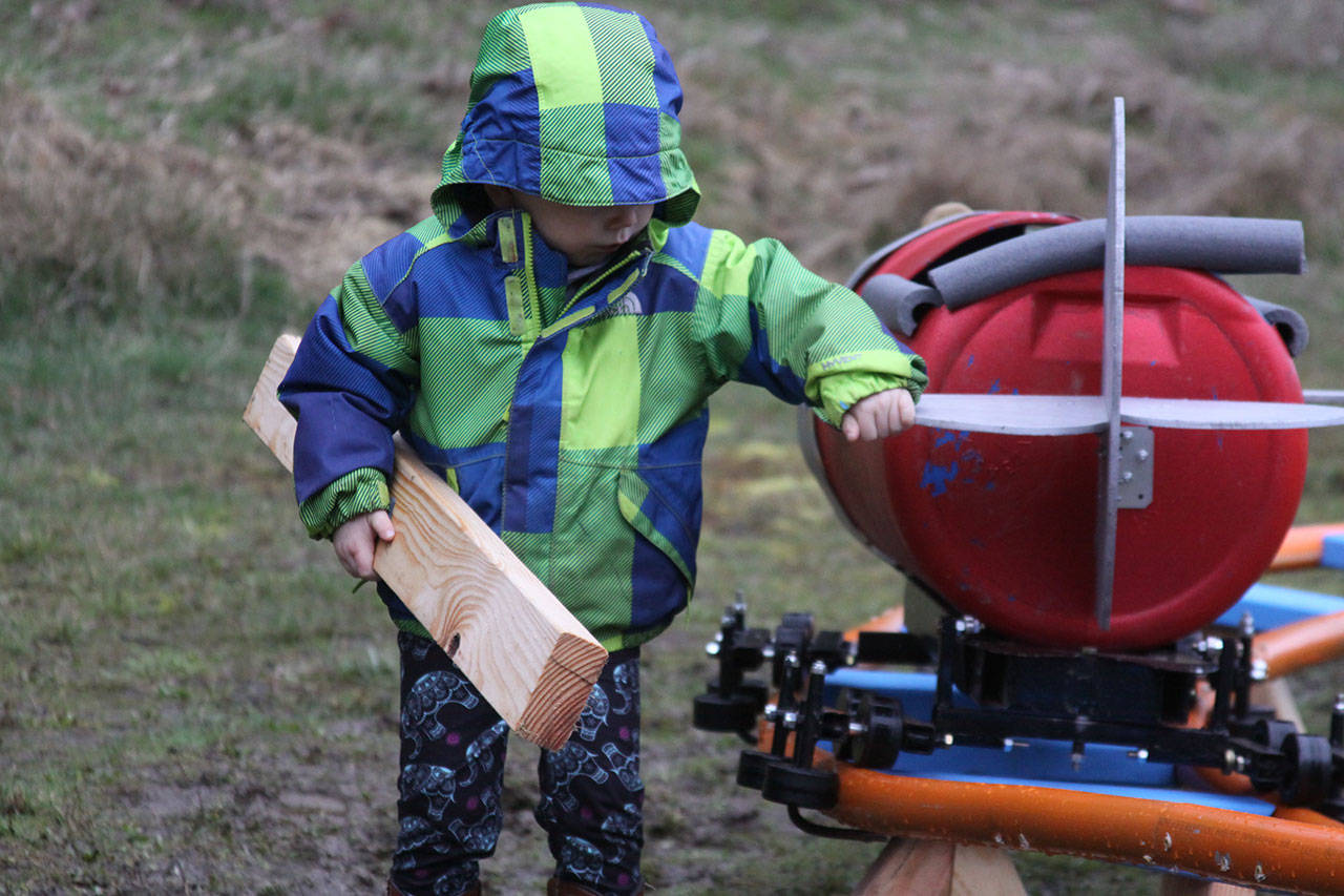 Wyatt Brazelton, 3, checks out his cart before takeoff. The two-by-four puts it in position Wednesday, March 1, 2017. Photo by Ron Newberry/Whidbey News-Times