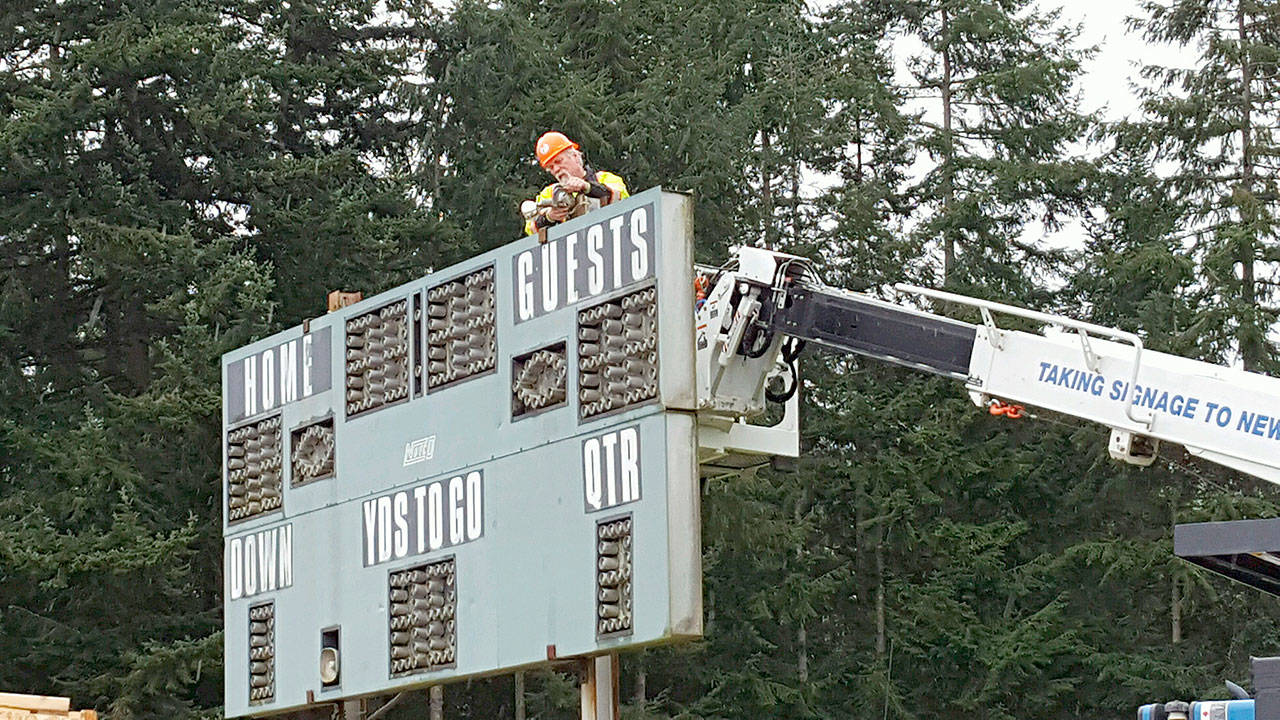 Jim Thompson photo — The three-decade-old football scoreboard at Waterman’s Field that has malfunctioned as of late is being replaced by a new Daktronic scoreboard purchased by the South Whidbey School District.