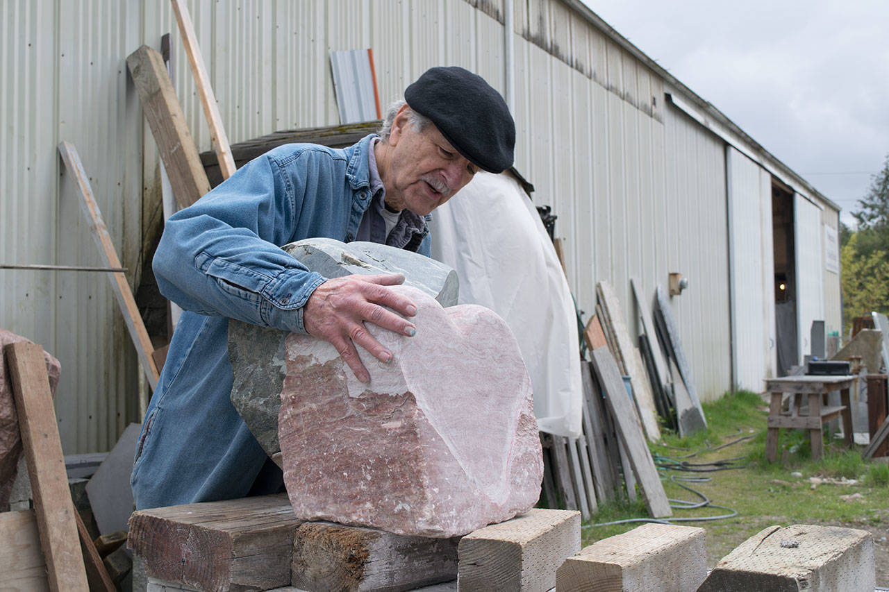 Kyle Jensen / The Record — Freeland Art Studios resident sculptor Frank Rose explains the idea behind one of Sue Taves’ unfinished pieces. Taves is also a resident sculptor at Freeland Art Studios.