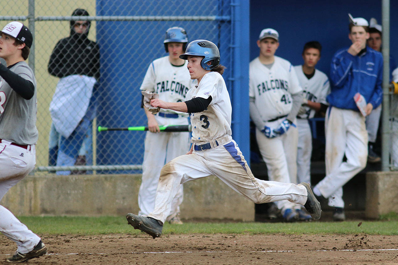 Matt Simms photo — South Whidbey senior Connor Antich prepares to slide home during the Falcons’ improbable eight-run comeback in the seventh inning against Cedarcrest on April 13. The Falcons won 10-9.