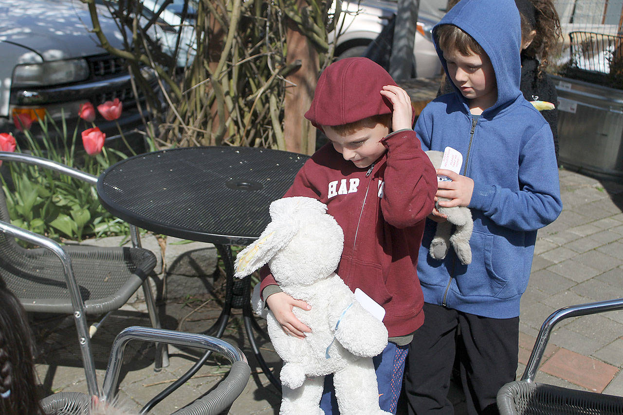 Evan Thompson / The Record — A grin flashes across 6-year-old Wyatt Walsh’s face after he was given a white bunny by Bjorn Beckstrom, another 6-year-old who participated in the 2017 Langley Bunny Daze Rabbit Hunt on Saturday.
