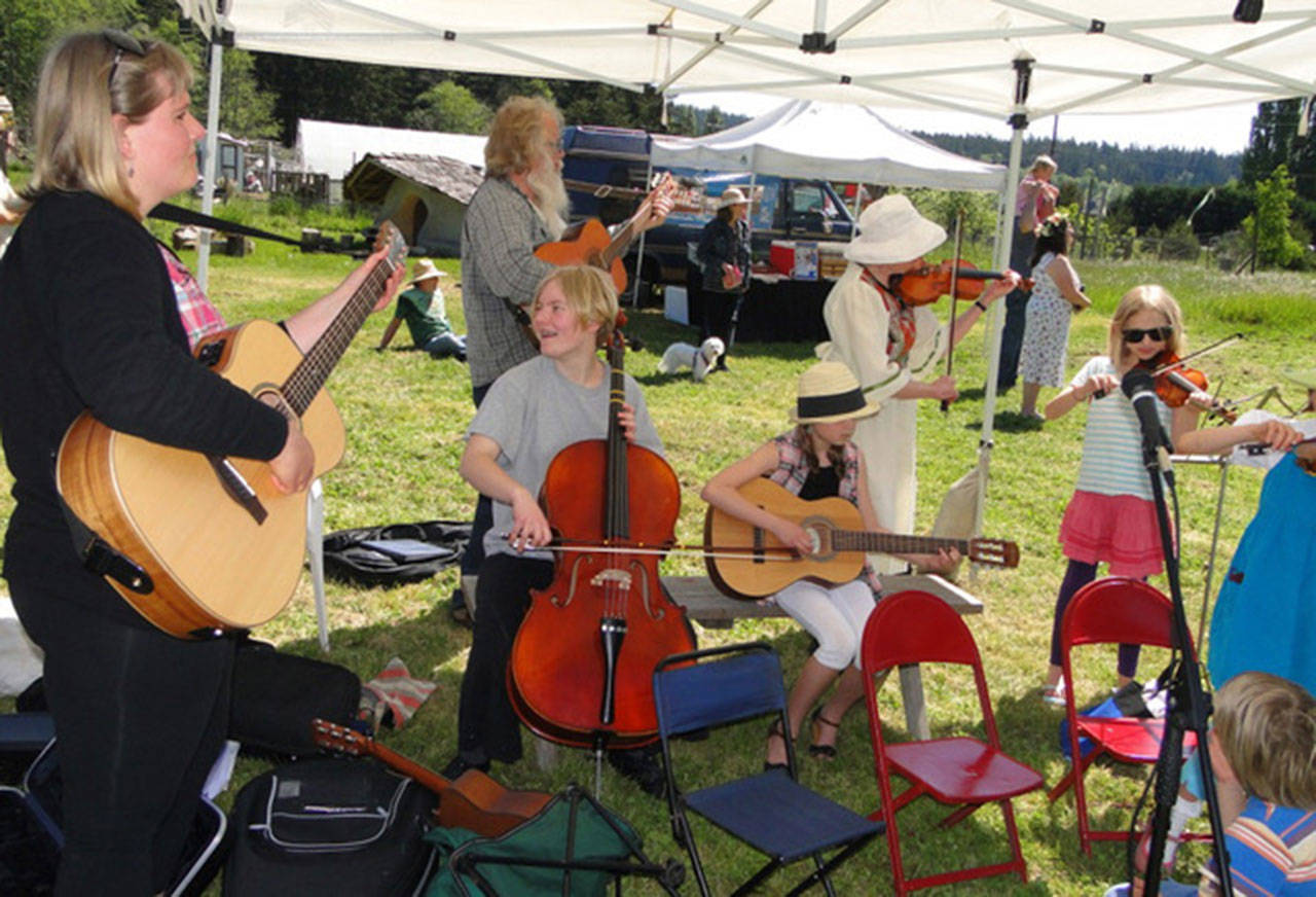 Contributed photo &mdash; Kids welcome in the 2016 season of the Tilth Farmers&rsquo; Market with music.