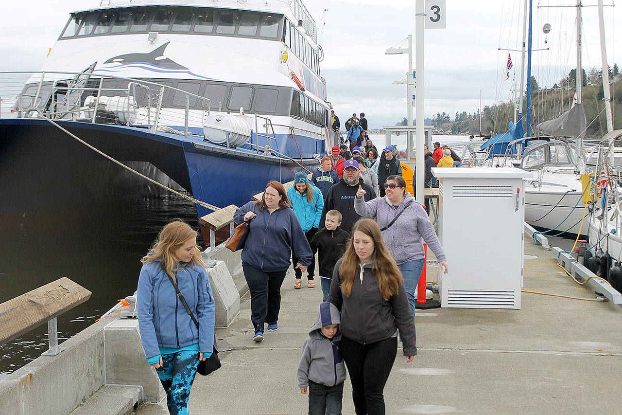 Evan Thompson / The Record — Passengers disembark from San Juan Clipper at South Whidbey Harbor on April 1. Around 200 people spent the next two hours in Langley shopping, eating and exploring downtown.