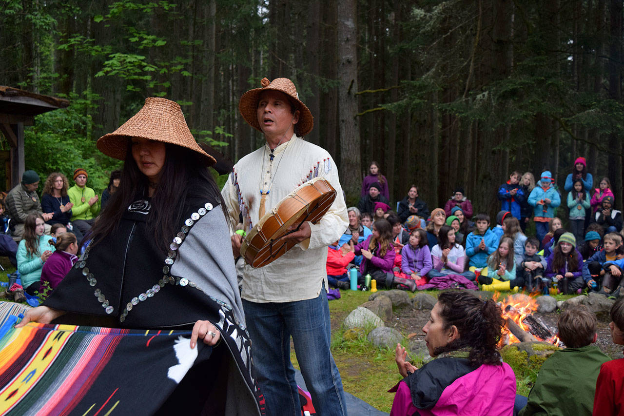 Kyle Jensen / The Record — Indigenous elders Sondra Segundo (left) and Paul Wagner (center) celebrate a gifting ceremony with the students.