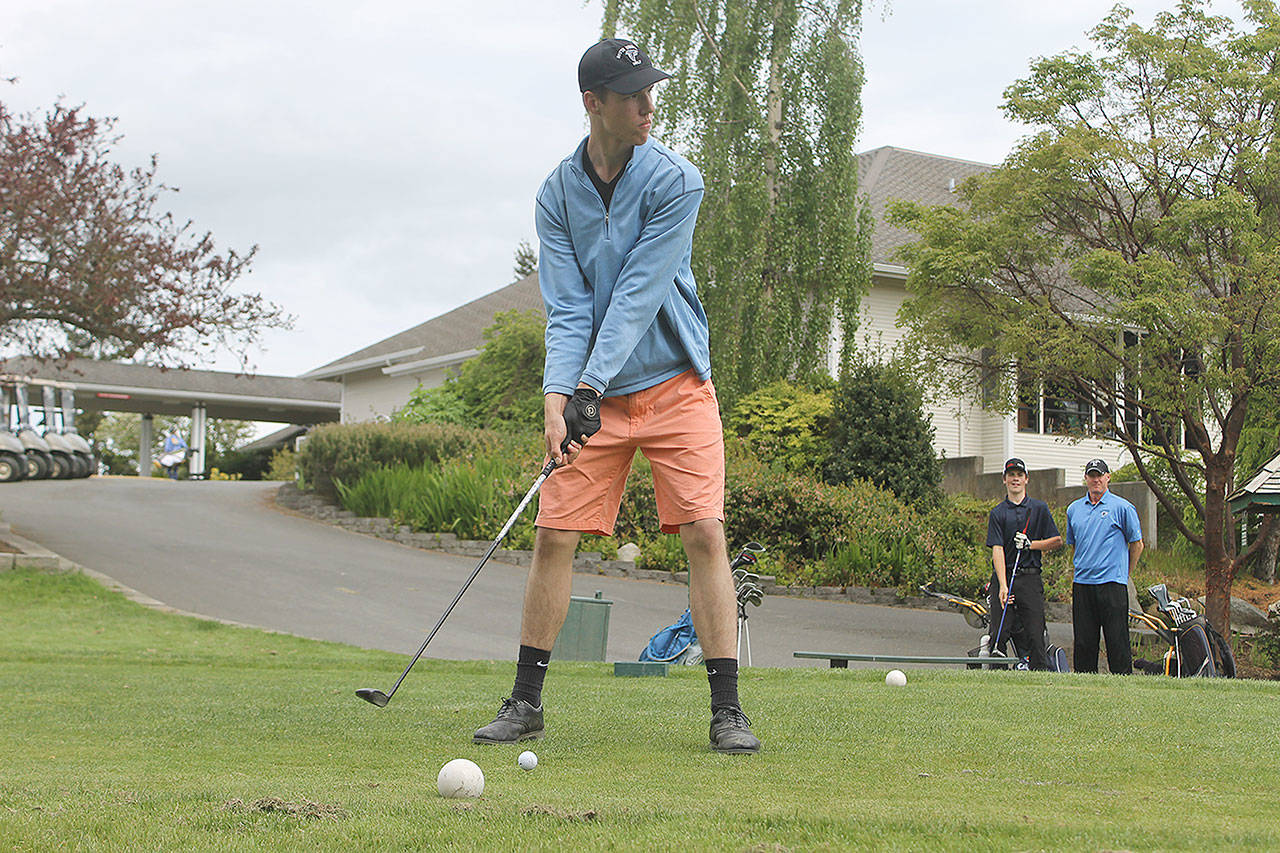 Evan Thompson / The Record — South Whidbey senior Anton Klein looks down hole one at Useless Bay Golf and Country Club during practice on Monday.