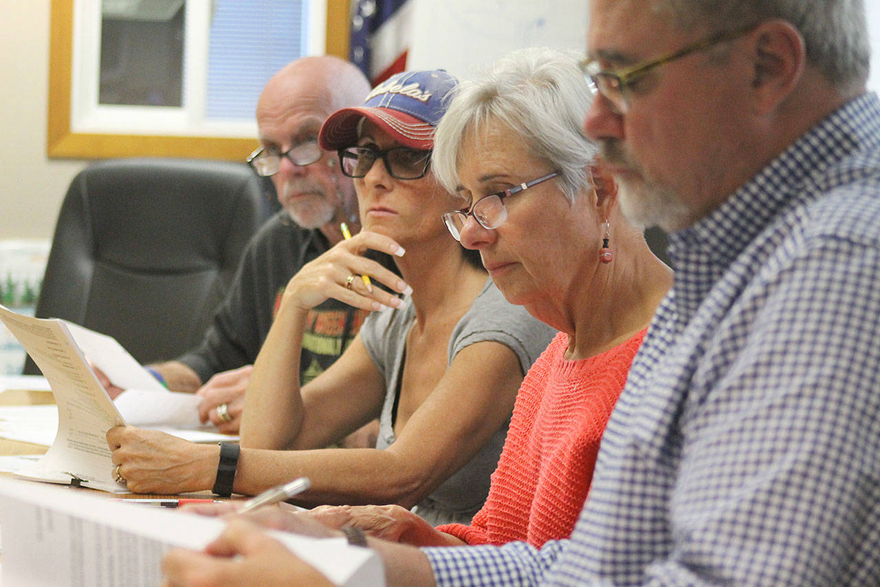 Evan Thompson / The Record — Council members Bruce Allen (far left) and Ursula Shoudy (second from left) voted to not approve an inclusive city ordinance at its regular monthly meeting on Monday night. Councilwoman Dominique Emerson (second from right) voted to keep it afloat. Councilman Burt Beusch (far right) recused himself from the vote.