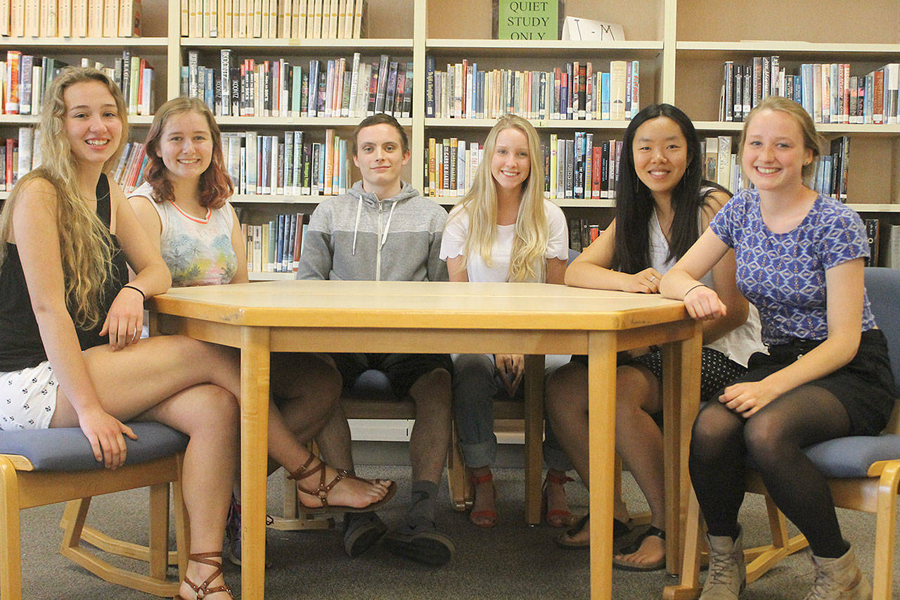 Evan Thompson / The Record — Six of South Whidbey’s seven valedictorians pose for a picture. From left to right: Kari Hustad, Fiona Callahan, Tyler Heggenes, Thandeka Brigham, Amelia Hensler and Chloe Hood. Emma Kerr, the seventh valedictorian, is not pictured.