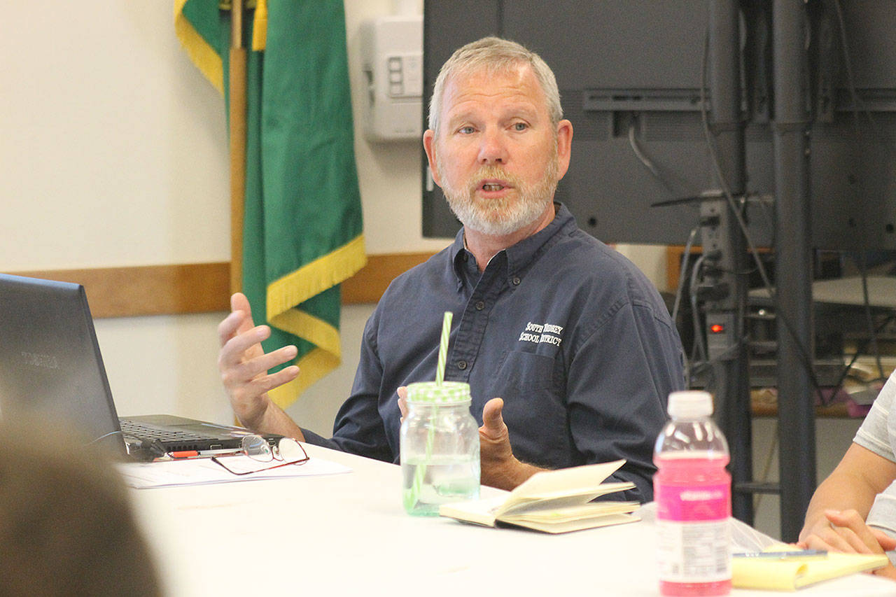 Evan Thompson / The Record — South Whidbey School District Assistant Superintendent of Business Dan Poolman discusses the property tax increases and other aspects of the state’s $43.7 billion budget at a South Whidbey School Board meeting on Wednesday.
