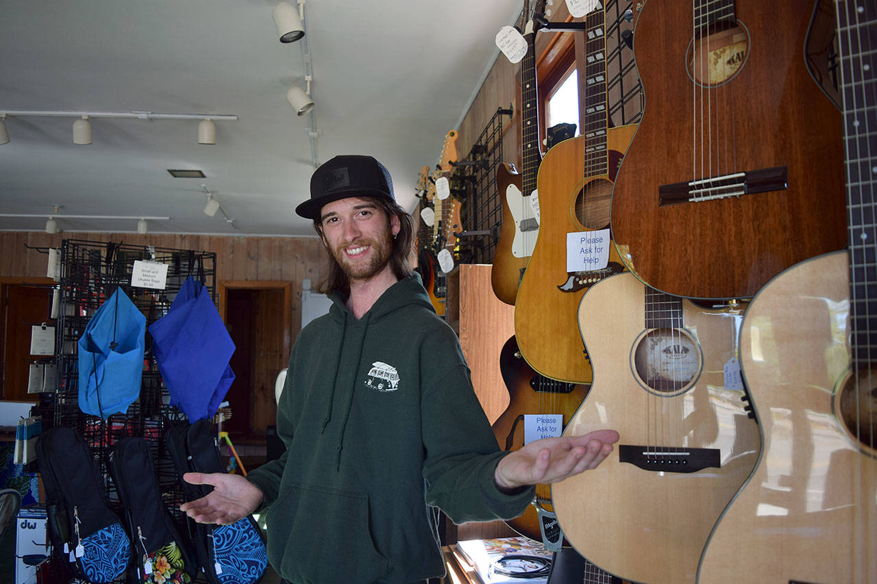 Kyle Jensen / The Record — Keegan Harshman, 25, recently returned to his hometown of Langley to open a music store in downtown Langley. His father, Chris Harshman, is the South Whidbey High School band director.