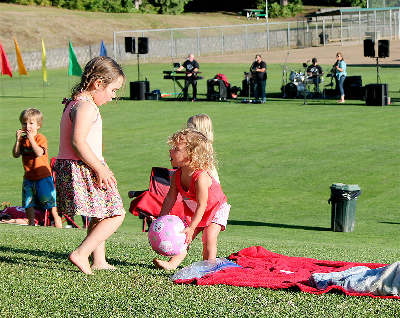 Record file — Kids play while their family have a picnic during last year’s Concerts in the Park series.