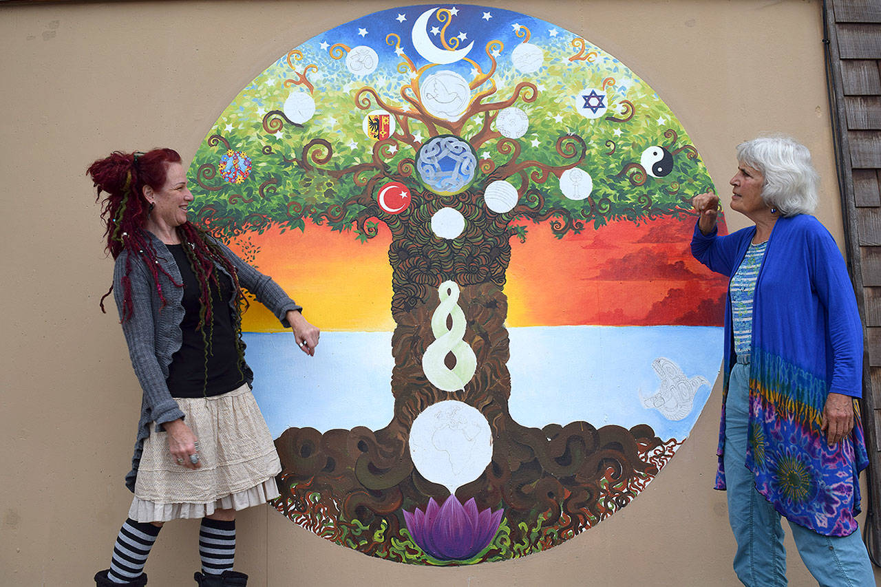 Kyle Jensen / The Record — Langley resident Jeanne Strong (right) elected to paint a mural on her home as a gift to her new neighborhood. Siobhan Wright (left) is the artist.