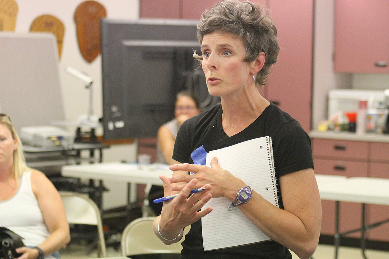 Evan Thompson / The Record                                Erin Simms, a parent, expressed concerns about the consolidation of Langley Middle School students at South Whidbey High School and other aspects about the middle school’s closure at a South Whidbey School Board meeting on July 26.