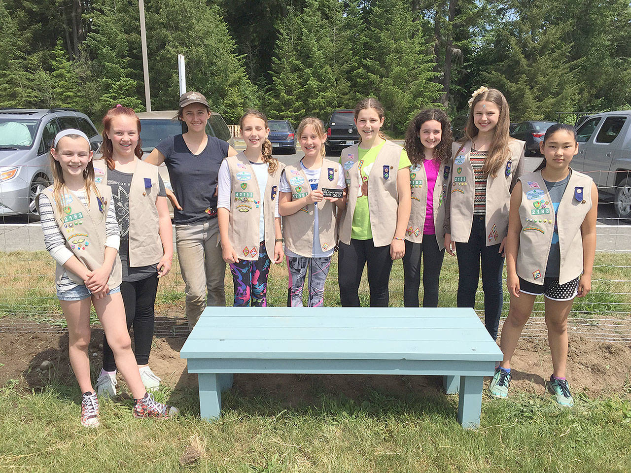 Evan Thompson / The Record &mdash; Cadette Girl Scout Troop 42183 donated a bench they made to South Whidbey High School&rsquo;s garden. From left to right: Freja Heggenes, Phoebe Hawkins, garden coordinator Raelani Kessler, Abigail Ireland, Parker Forsyth, Emma Callahan, Eva Wirth, Taryn Henny, and Chloe Goethel.