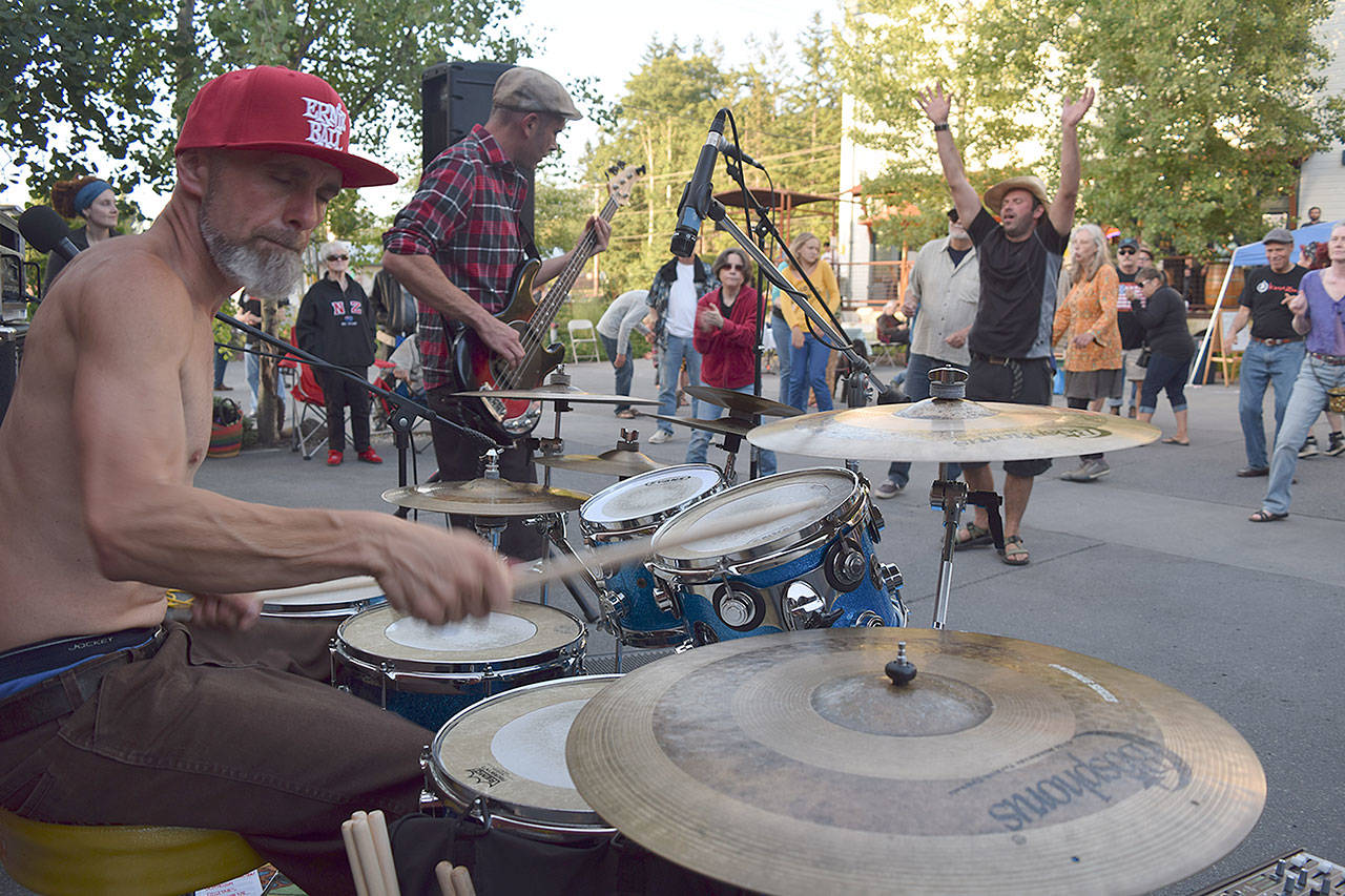 Kyle Jensen / The Record — Krash Zen drummer Rachman Ross and bassist Stephen Ross play in front of a crowd at the Bayview Street Dance on June 28 at the Bayview Cash Store. Krash Zen is performing at the Langley Street Dance on Second Street on July 8.