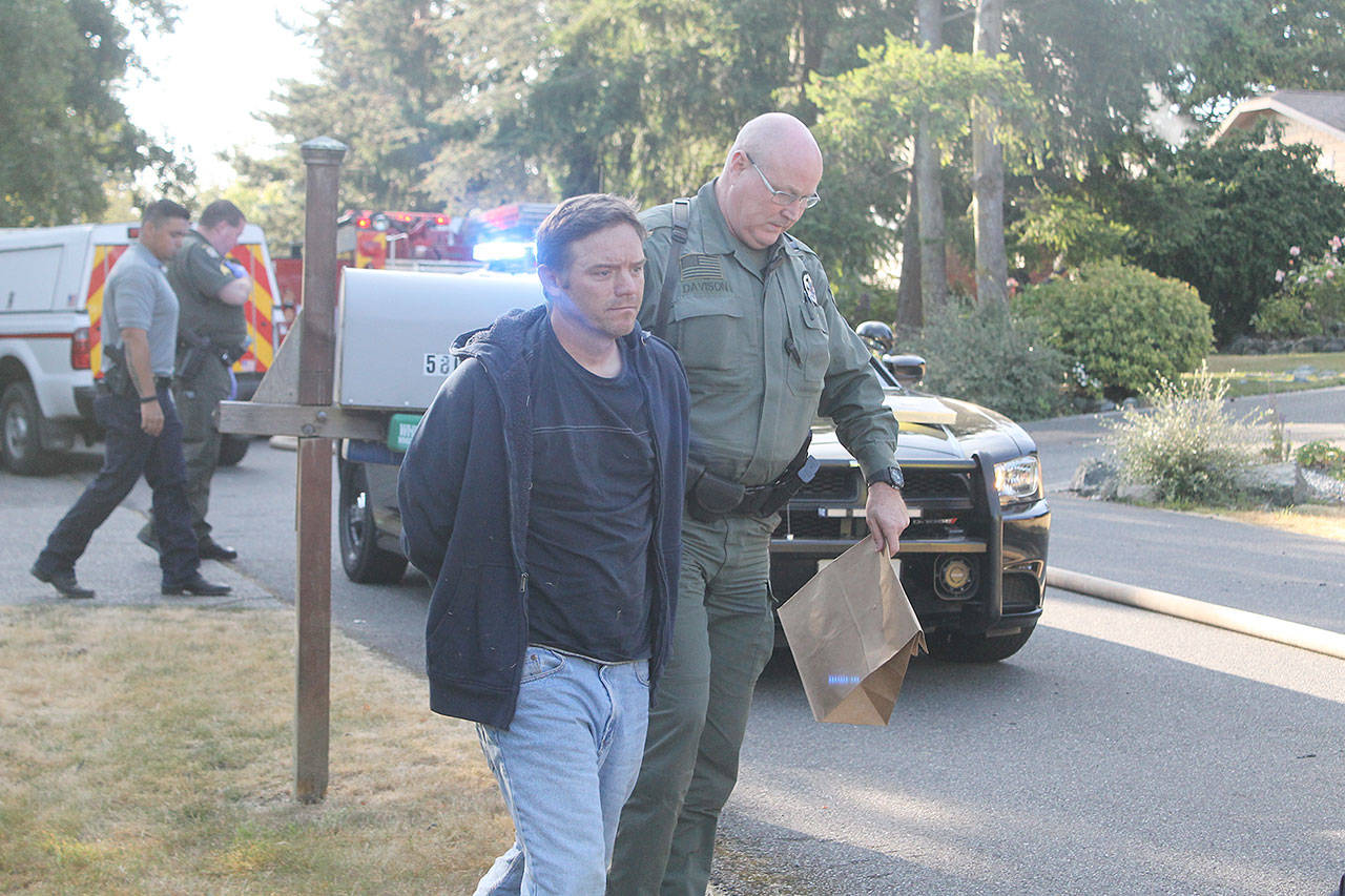 Evan Thompson / The Record — Blake Fountain, 48, is suspected of burning down a Useless Bay Colony home and partially destroying another on Thursday morning. Island County Sheriff Mark Brown said Fountain is being investigated for first-degree arson.