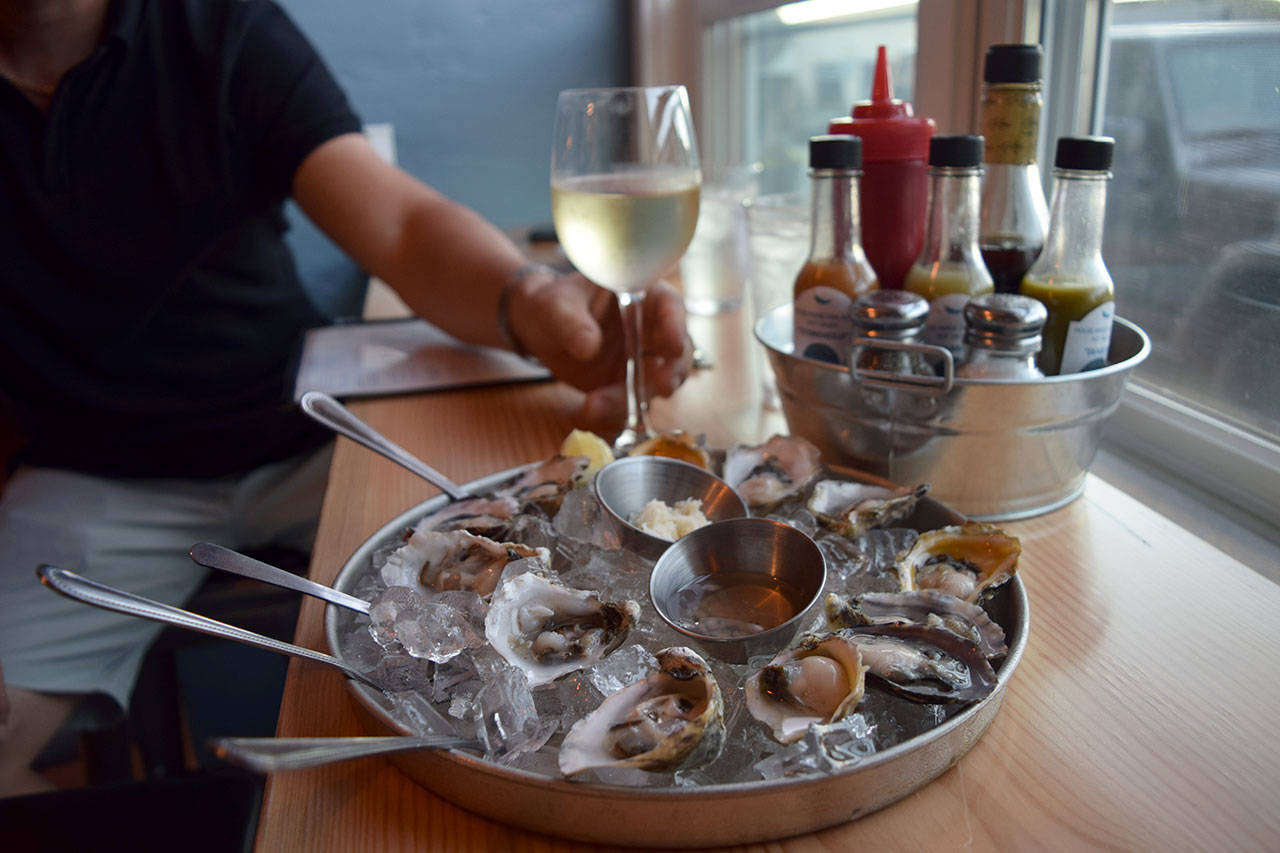 Kyle Jensen / The Record &mdash; A dozen oysters, including Willapa Bay and Fanny Bay oysters, are served to customers.