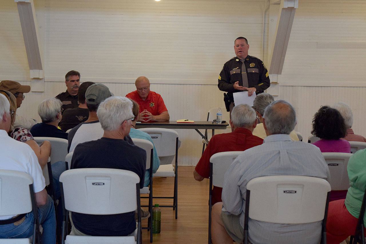 Kyle Jensen / The Record — Sgt. Darren Crownover discusses a suspected “drug house” in the Sun Vista neighborhood alongside Sheriff Mark Brown and Lt. Evan Tingstad. Neighbors have been suspicious of criminal activity on the property for years.