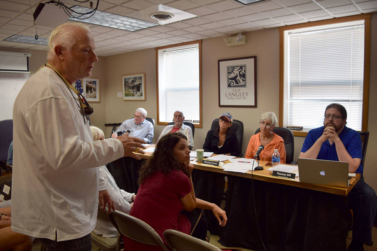 Kyle Jensen / The Record &mdash; Moe Jerome, a resident artist from Whidbey Art Gallery, discusses the way cities near Whidbey Island provide coverage for art installments.