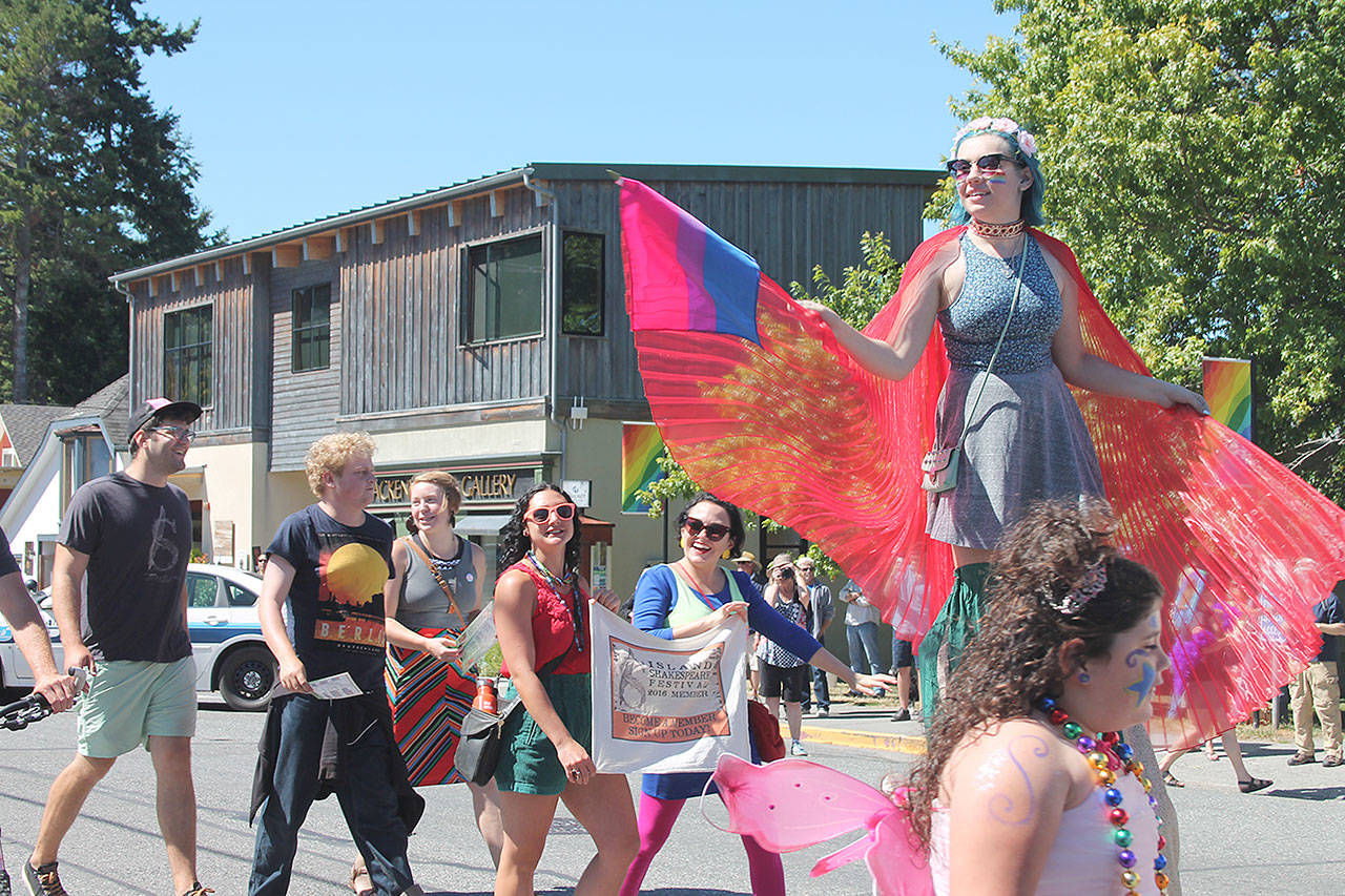Record file — Participants in the 2016 Queer Pride Parade travel along First Street in downtown Langley. The 4th Annual Queer Pride Parade is set for 2 p.m. on Sunday, Aug. 13.