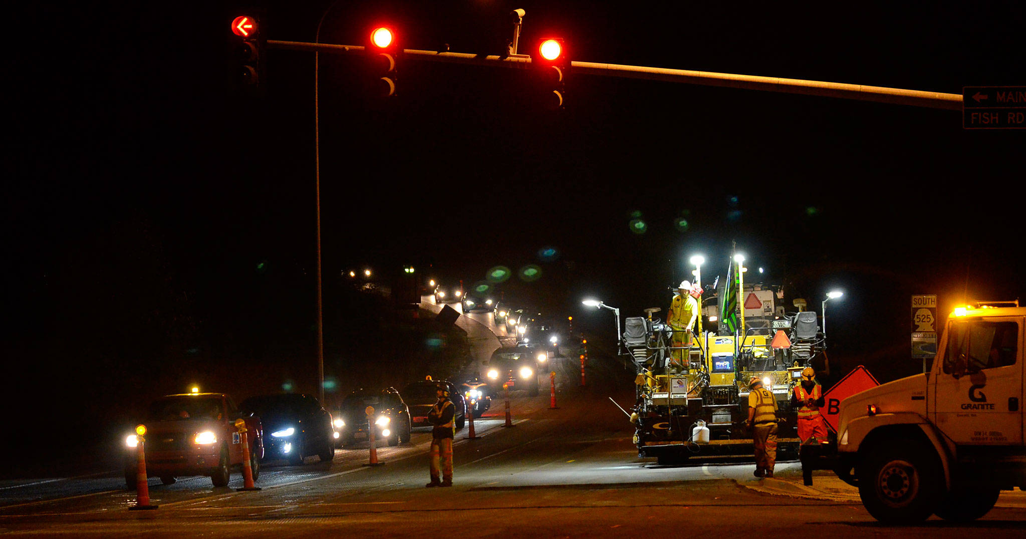 Justin Burnett/The Record — Granite Construction crews set up to pave the intersection at Highway 525 and Fish Road in Freeland on Thursday night. State officials say daytime work is largely over, and that project is set to conclude this fall.