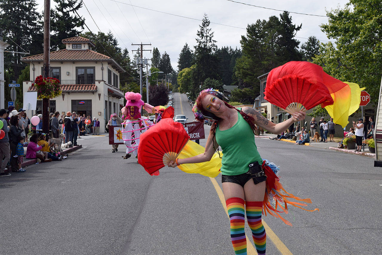 Kyle Jensen / The Record &mdash; Langley resident Siobhan Wright glides across the street in her roller blades during the parade.
