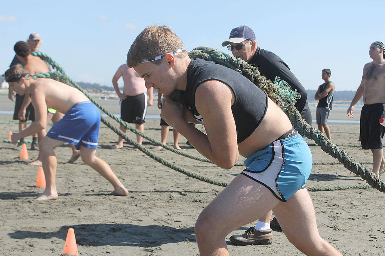 Evan Thompson / The Record — South Whidbey junior Caden Spear prepares for the final race of the three-day beach practice sessions on Aug. 19 at Double Bluff Beach.