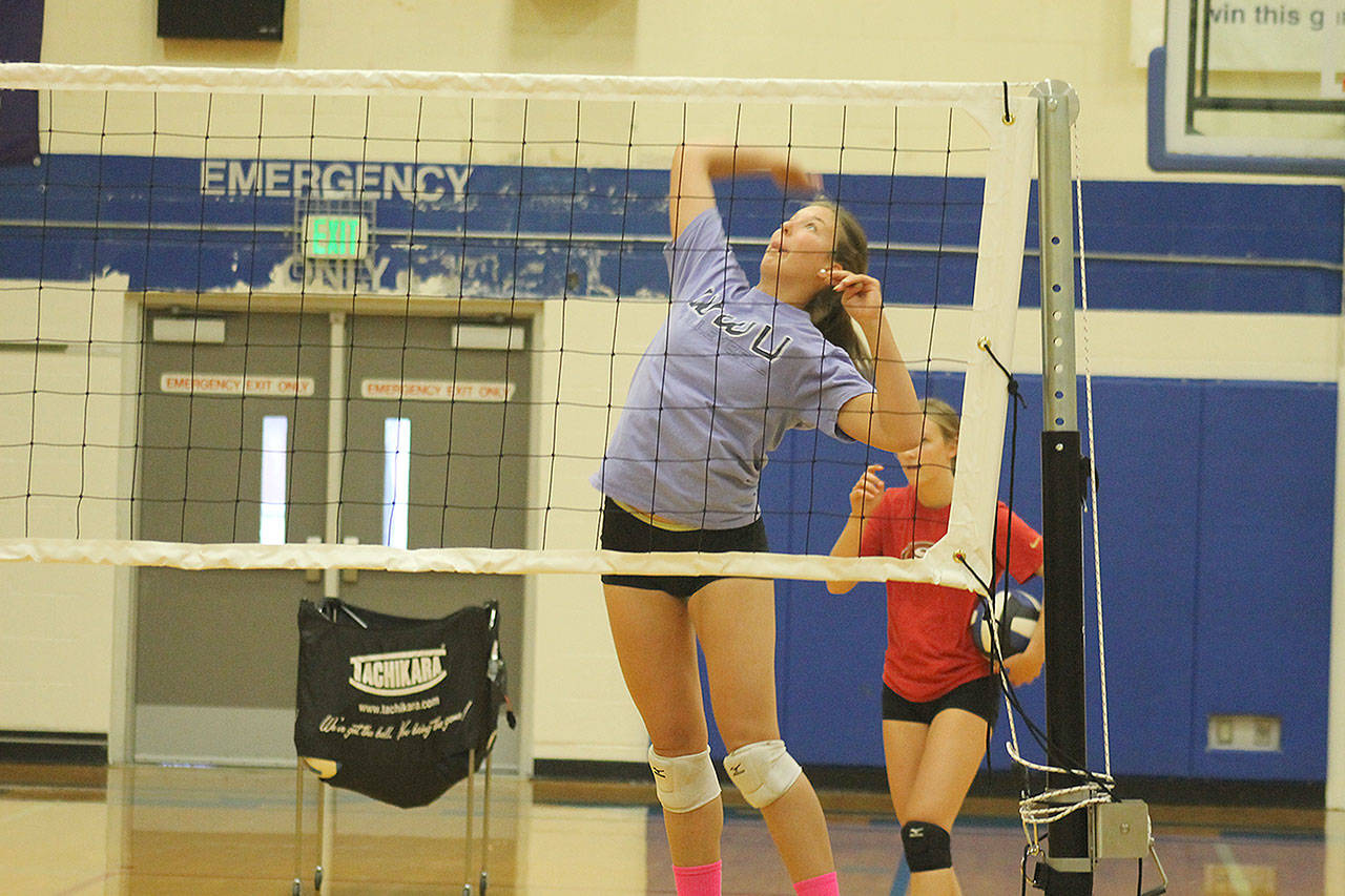 Evan Thompson / The Record — South Whidbey junior outside hitter Emma Leggett spikes a ball during practice.